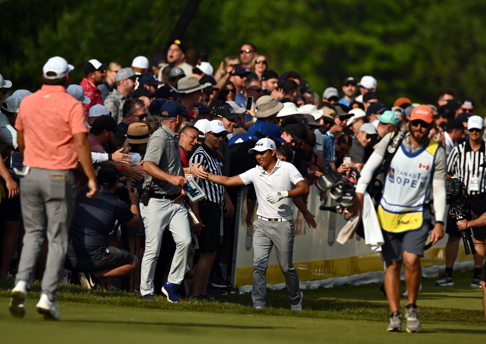 C,T. Pan greets fans during the third round of the RBC Canadian Open on Saturday. Credit Getty Images