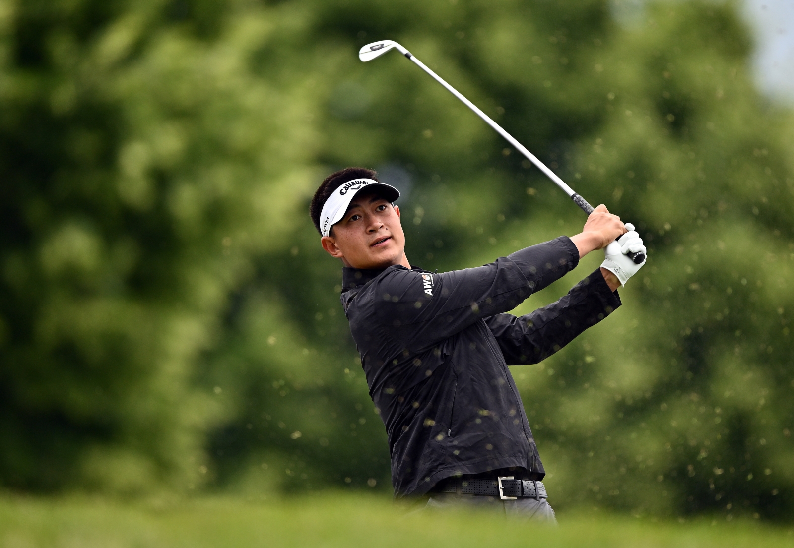 Carl Yuan watches his approach shot during the first round at the RBC Canadian Open. Credit Getty Images