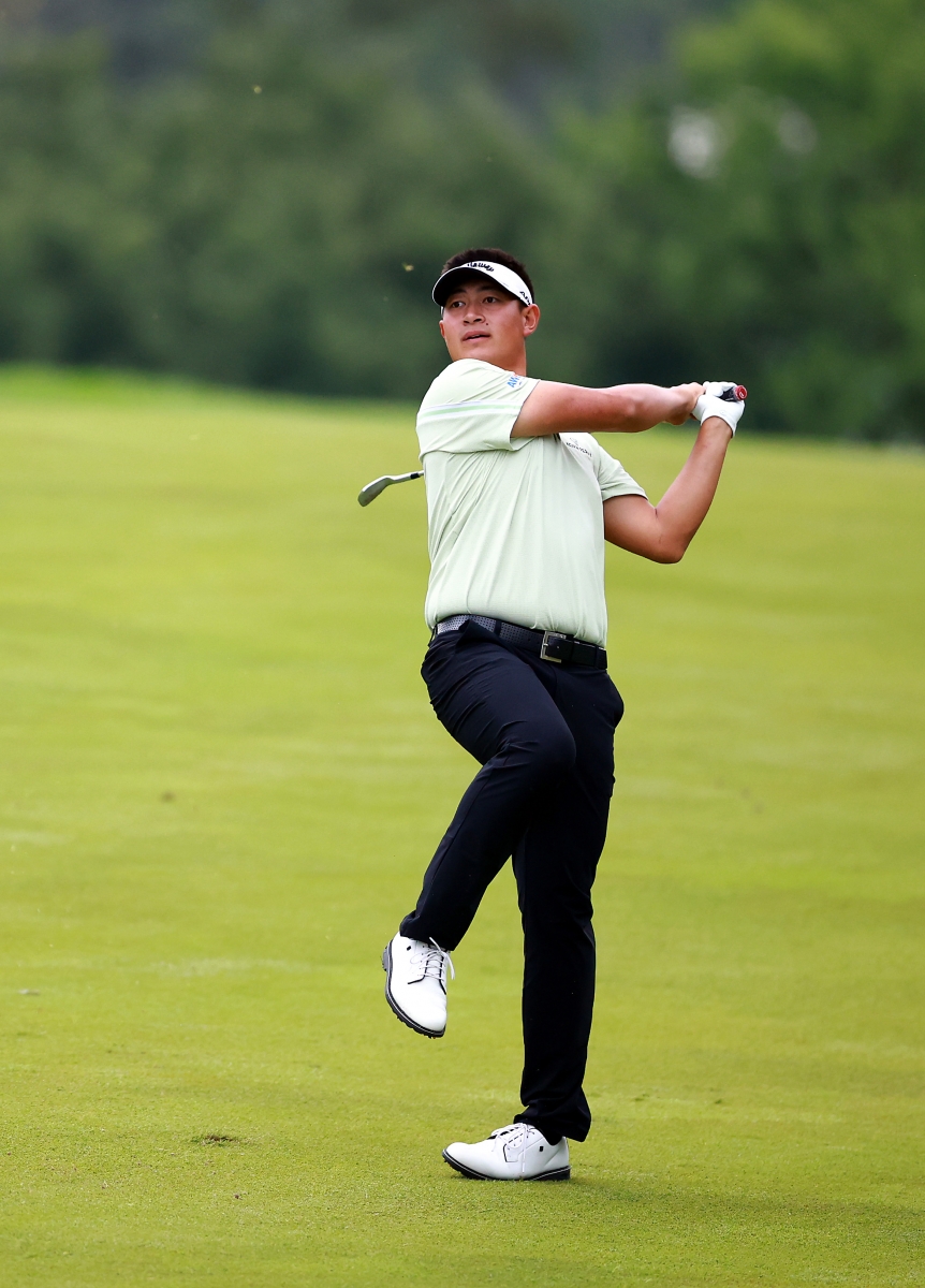 China's Carl Yuan watches his second shot on the 16th hole during the second round of the RBC Canadian Open. Credit Getty Images.