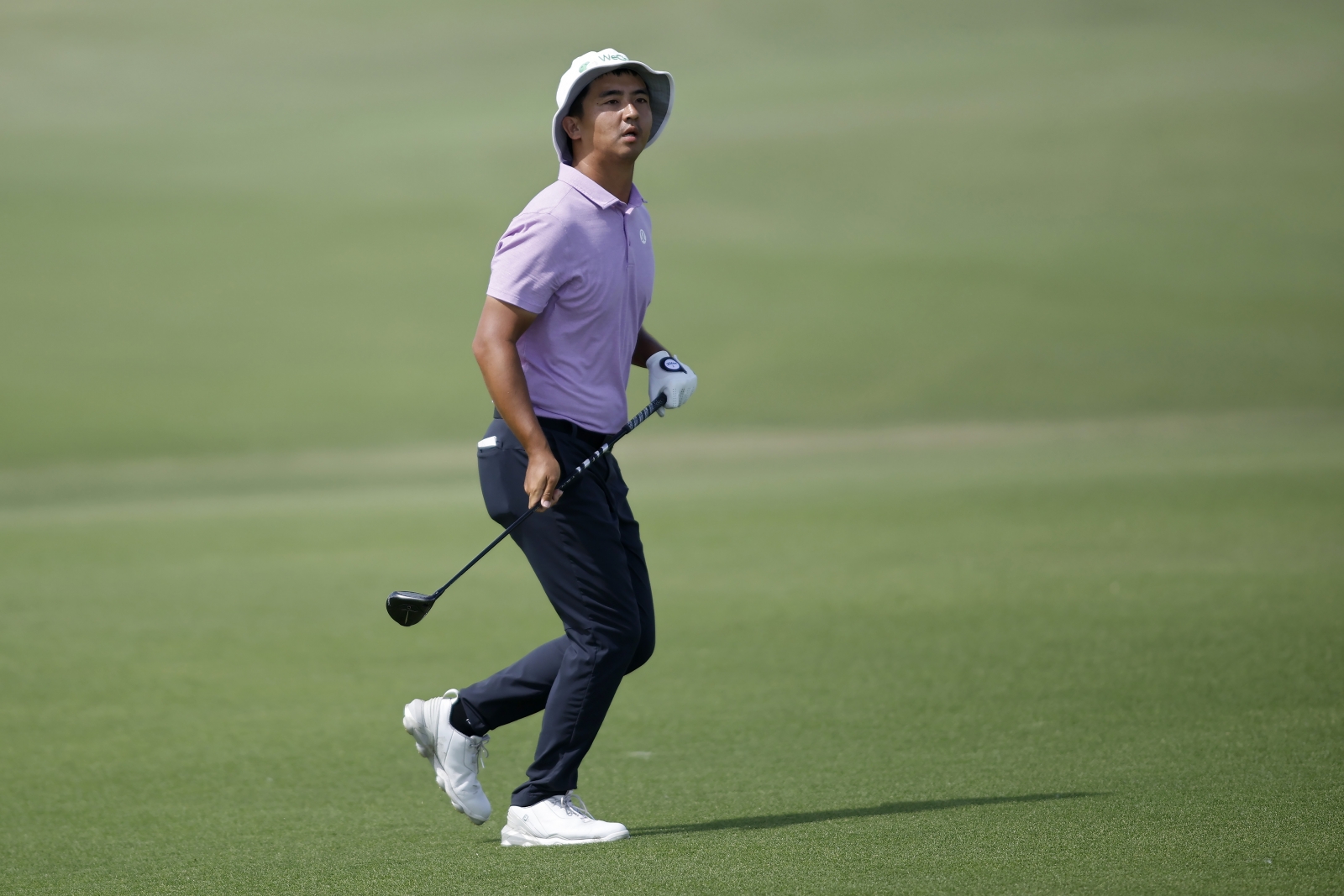 China's Marty Zecheng Dou runs to watch his shot during the AT&T Byron Nelson on Saturday. Credit Getty Images