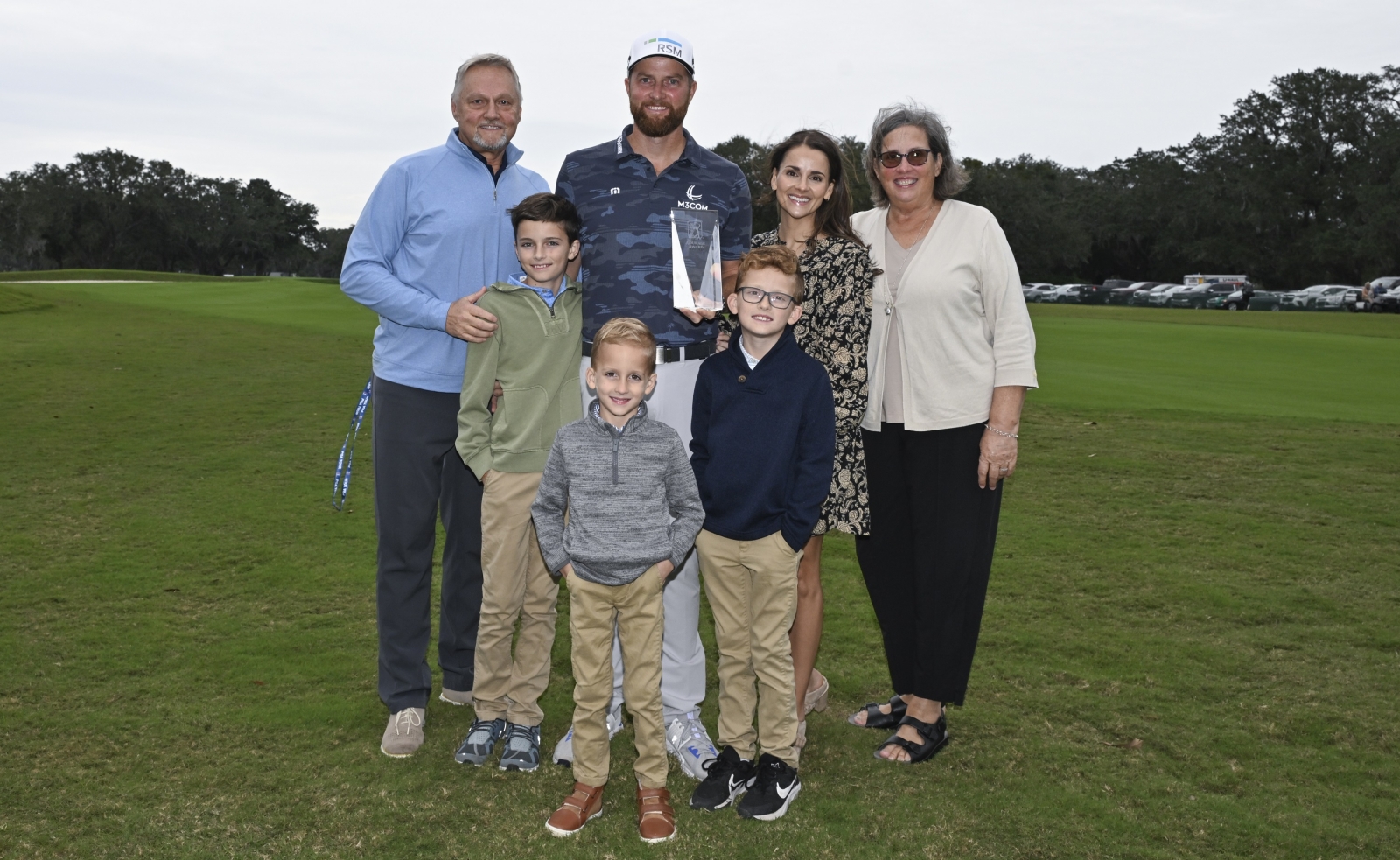 Chris Kirk with his family and the PGA TOUR Courage Award1. Credit Getty Images