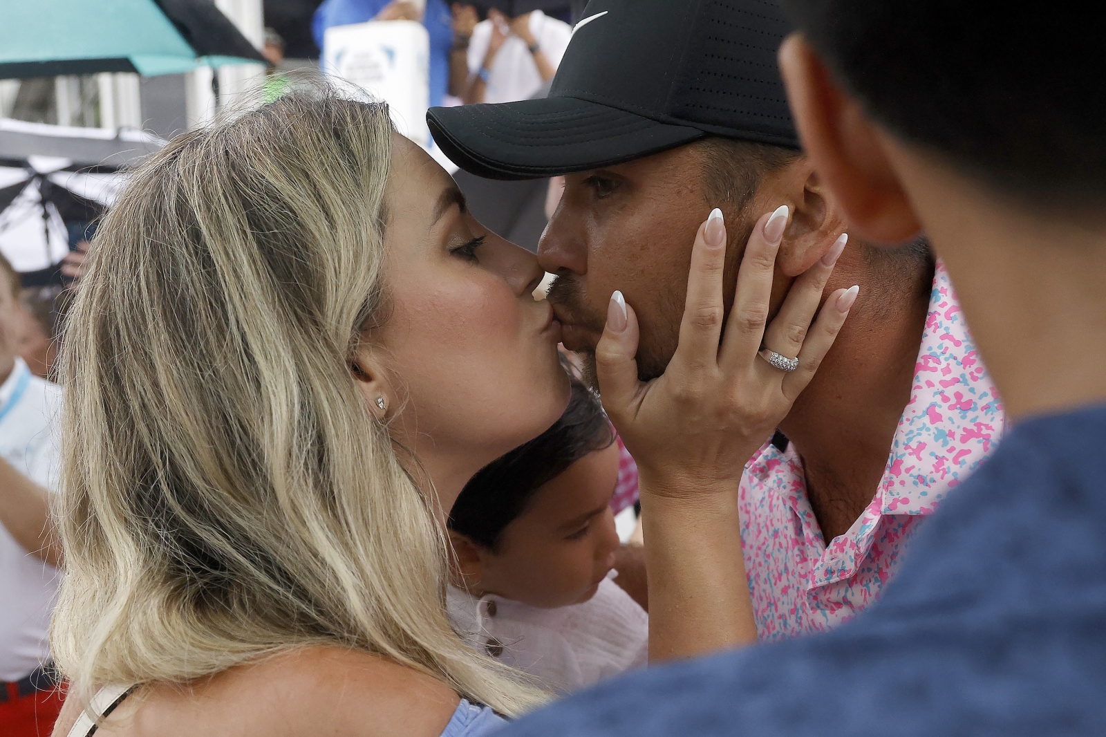 Jason Day gets a kiss from his wife Ellie after his win at AT&T Byron Nelson. Credit Getty Images